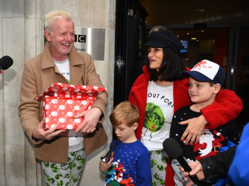 Chris Evans leaves Wogan House in London, with his wife, Natasha, and sons Noah (right) and Eli, after presenting his final BBC Radio 2 breakfast show (Kirsty O’Connor/PA)