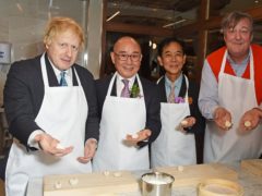 (L-R) Boris Johnson, Mr Yang Chi Hua, Mr George Quek and Stephen Fry attend the UK launch of Din Tai Fung in Covent Garden on December 5, 2018 in London, England. (Credit: Dave Benett)
