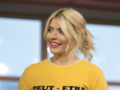 Holly Willoughby wore a long fitted gown (Isabel Infantes/PA)