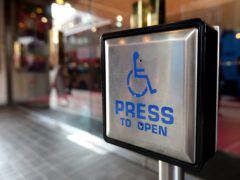 File photo dated 15/09/14 of a disabled entrance door button. The Government is being urged to make firms publish their disability pay gaps after new research suggested the difference with other workers has hit more than £2,800 a year.