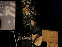 Musician Billy Ray Cyrus performs a song during funeral services for Davis Police Officer Natalie Corona (Rich Pedroncelli/AP)
