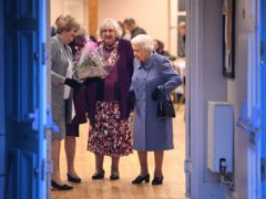 The Queen (right) leaves after attending a Sandringham Women’s Institute (WI) meeting at West Newton Village Hall, Norfolk (Joe Giddens/PA)
