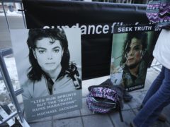 Signs in support of Michael Jackson are seen outside of the premiere of Leaving Neverland (Danny Moloshok/Invision/AP)