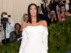 Kim Kardashian-West has slammed fashion brands who ‘rip-off’ the designs she wears often hours after she is pictured wearing them (Aurore Marechal/PA)