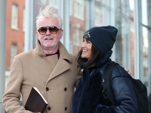 Chris Evans leaves the Virgin Radio studio with his wife Natasha (Yui Mok/PA)