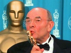 Stanley Donen kisses the Oscar he received for Lifetime Achievement (Reed Saxon/AP)