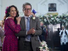 Andie MacDowell and Hugh Grant during the filming of One Red Nose Day and a Wedding (Comic Relief/PA)