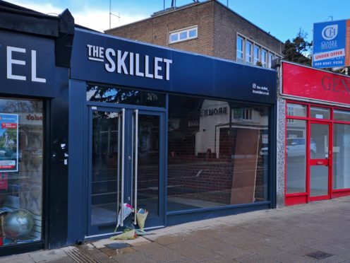 Tributes left outside the cafe in Loughton that Mike Thalassitis planned to open before he was found dead (Lewis Pennock/PA)