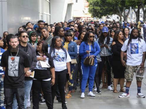 Fans of rapper Nipsey Hussle wait in line to attend a public memorial service at the Staples Center (AP)