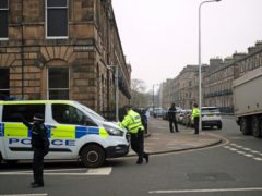 Forensic officers at the scene of the shooting in Edinburgh’s west end (Jane Barlow/PA)