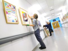 The Paintings in Hospitals team at work at Queen Elizabeth Hospital Birmingham (Painting in Hospitals/PA)