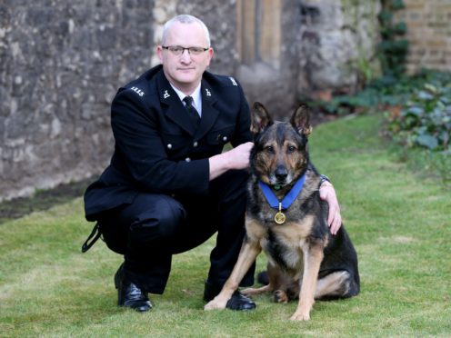Pc Dave Wardell and Finn are into the BGT final (Jonathan Brady/PA)