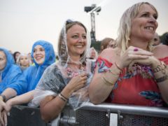 Michael Buble fans in the rain during his performance at the British Summer Time festival in London’s Hyde Park in 2018 (Isabel Infantes/PA)