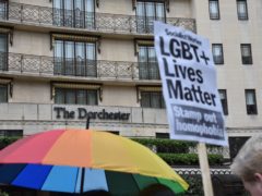 Protestors outside The Dorchester hotel on Park Lane, London demonstrating against the Brunei anti-gay laws.