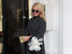 Pamela Anderson arriving to visit Julian Assange at the Ecuadorian embassy in London in 2017 (Jonathan Brady/PA)