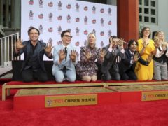 Johnny Galecki, from left, Jim Parsons, Kaley Cuoco, Simon Helberg, Kunal Nayyar, Mayim Bialik and Melissa Rauch members of the cast of the TV series “The Big Bang Theory,” show their hands after placing them in cement during a hand and footprint ceremony at the TCL Chinese Theatre on Wednesday, May 1, 2019 at in Los Angeles. (Photo by Willy Sanjuan/Invision/AP)