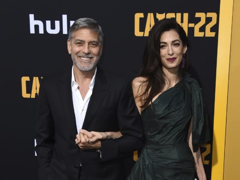 George and Amal Clooney arrive at the Los Angeles premiere of Catch-22 (Jordan Strauss/Invision/AP)