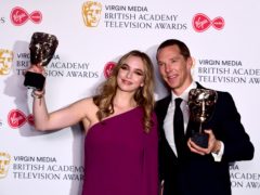 Jodie Comer and Benedict Cumberbatch show off their awards (Ian West/PA)