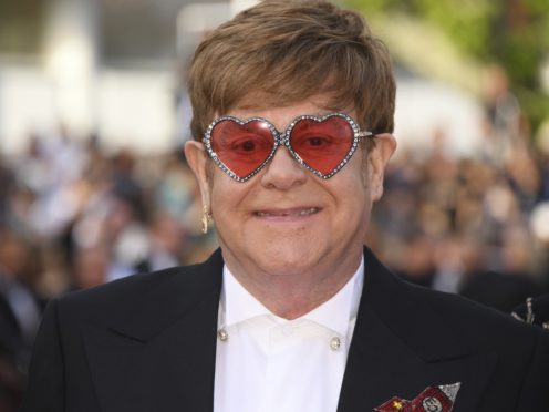 Sir Elton John poses for photographers upon arrival at the premiere of Rocketman (Arthur Mola/Invision/AP)