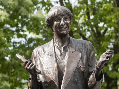 The life-size bronze statue of the late comedian, writer and actor, Victoria Wood in Bury town centre (Danny Lawson/PA)