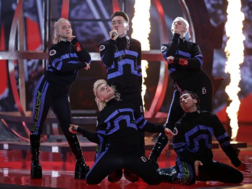 Hatari of Iceland perform the song “Hatrio mun sigra” during the 2019 Eurovision Song Contest grand final rehearsal in Tel Aviv, Israel, Friday, May 17, 2019. (AP Photo/Sebastian Scheiner)