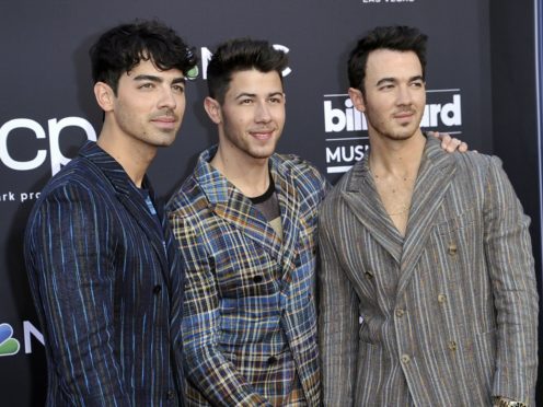 The Jonas Brothers will release a memoir later this year, the band has announced (Richard Shotwell/Invision/AP, File)