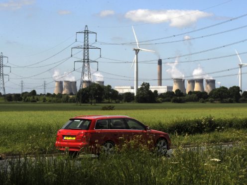 Net zero would require emissions to be eliminated from electricity and transport (John Giles/PA)