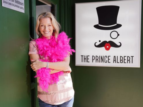 Kathy Beale outside EastEnders’ first gay bar The Prince Albert (EastEnders/BBC/PA)