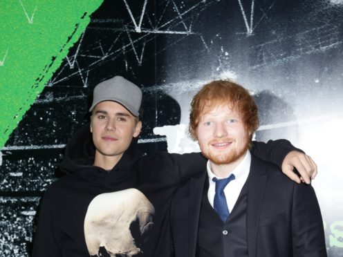 Justin Bieber and Ed Sheeran currently sit at number one (Yui Mok/PA)
