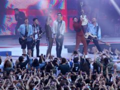 The Jonas Brothers and Busted erform Year 3000 on stage during Capital’s Summertime Ball (Isabel Infantes/PA)