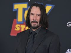 The boss of Marvel Studios has revealed he has been trying to recruit Keanu Reeves to star in a superhero film (Richard Shotwell/Invision/AP)