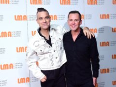 Robbie Williams and Scott Mills at a press conference with X Factor’s LMA Choir at White City House, London (Ian West/PA)