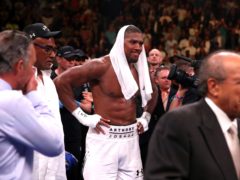 Anthony Joshua (centre) appears dejected after losing to Andy Ruiz Jr in the WBA, IBF, WBO and IBO Heavyweight World Championship match at Madison Square Garden, New York (Nick Potts/PA)