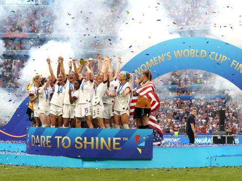 USA’s Megan Rapinoe (centre) and team-mates celebrate with the FIFA Women’s World Cup Trophy (PA)