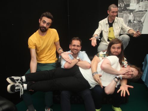 Members of Bastille pose backstage with singer Lewis Capaldi ahead of his guest appearance with the band on the Pyramid Stage at Glastonbury (Yui Mok/PA)