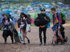 Festival goers leave the camp (Aaron Chown/PA)