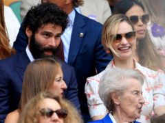 Aidan Turner and Lily James in the crowd (Adam Davy/PA)