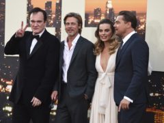 Quentin Tarantino poses with cast members Brad Pitt, Margot Robbie and Leonardo DiCaprio (Jordan Strauss/AP)