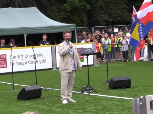 Actor Michael Sheen delivers the opening address at the 2019 Homeless World Cup in Cardiff, Wales (PA)