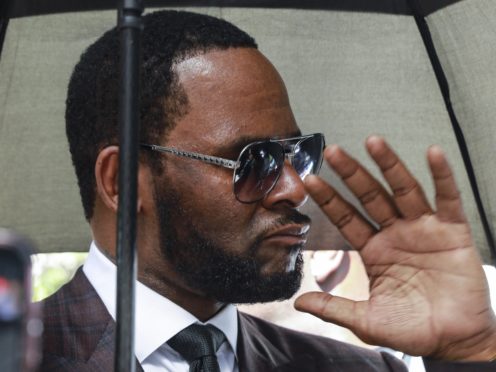 Musician R Kelly departs from the Leighton Criminal Court building (Amr Alfiky/AP)
