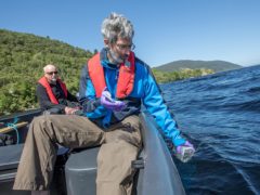 Director of the Rivers and Lochs Institute at Inverness College UHI Professor Eric Verspoor (left) and molecular ecologist Lucio Marcello in a boat on Loch Ness, are part of the team who have been investigating the waters of Loch Ness (Paul Campbell/Inverness UHI/PA)