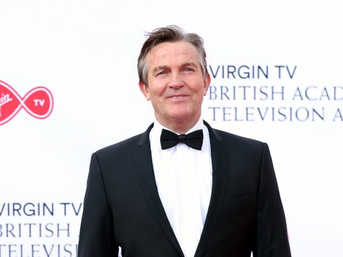 Bradley Walsh said he ‘can’t wait to cheer up the nation with Holly at my side’ (Isabel Infantes/PA)
