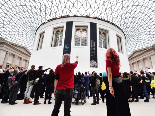 Activists from the pressure group BP Or Not BP protest in the Great Court of the British Museum in London (John Stillwell/PA)