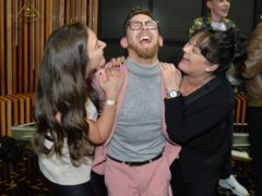 Winner Paddy Smyth, celebrates with his mother and sister, following the live final of the second series of Channel 4’s The Circle, in Salford, Manchester. (Peter Powell/PA)