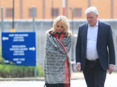 Pamela Anderson leaves Belmarsh Prison accompanied by WikiLeaks editor Kristinn Hrafnsson (Gareth Fuller/PA)