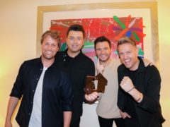 Westlife with their number one album award for Spectrum (OfficialCharts.com/PA)