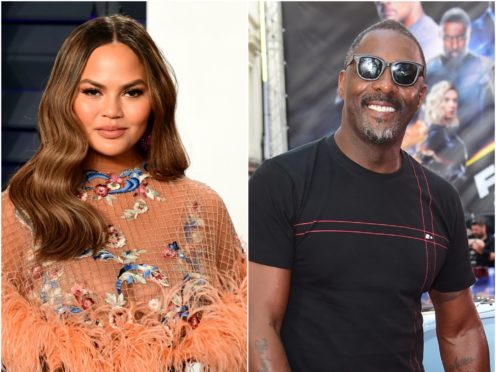 Chrissy Teigen jokingly apologised to husband John Legend after Idris Elba replied to her throwback challenge (PA)