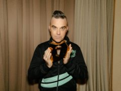 Robbie Williams has scored his 13th number one album with The Christmas Present (Leo Baron/Official Charts Company/PA)