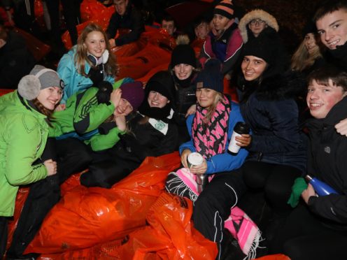 People slept out overnight in cities across the world (Stewart Attwood/PA)