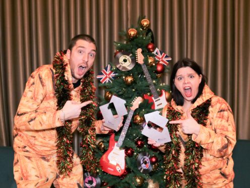 YouTube star Mark Hoyle – aka LadBaby – and his wife Roxanne celebrate their second Christmas number one in a row (OfficialCharts.com/PA)